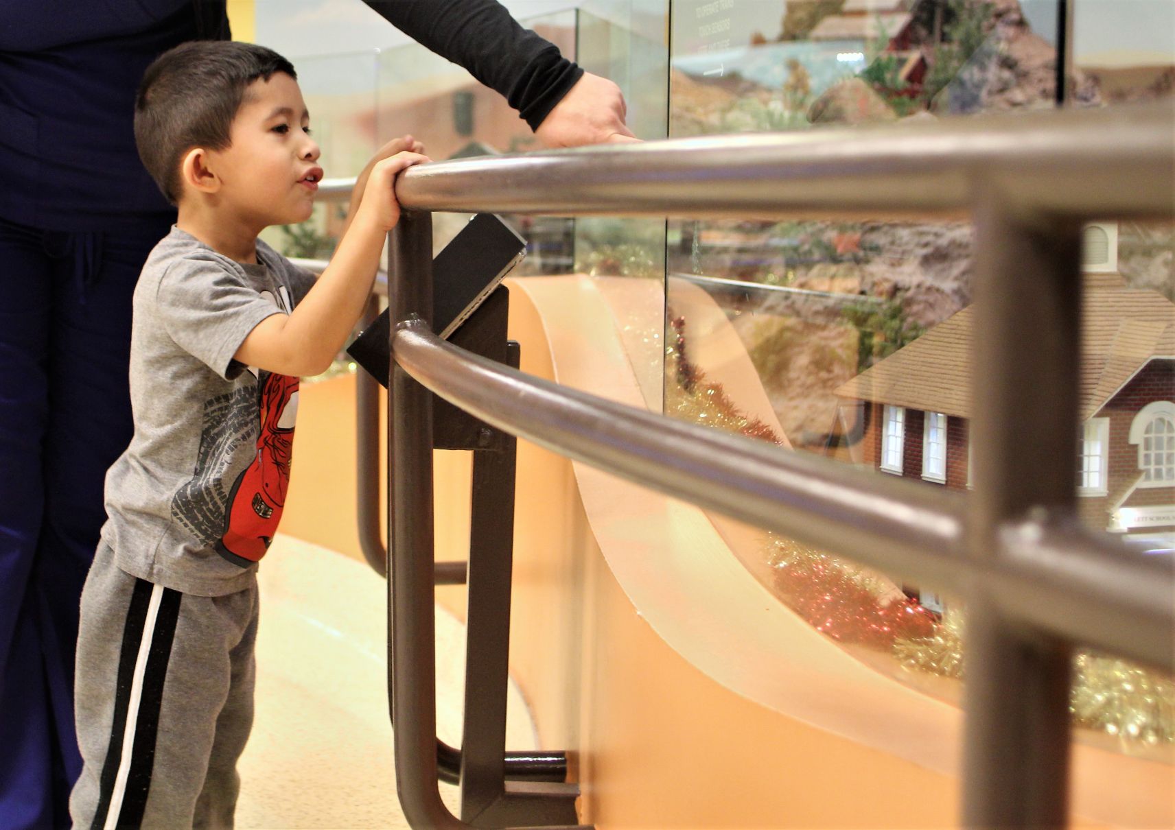 Jovanni Perez, 3, of Mesa, stares intently at the garden train display inside Cardon Children’s Medical Center